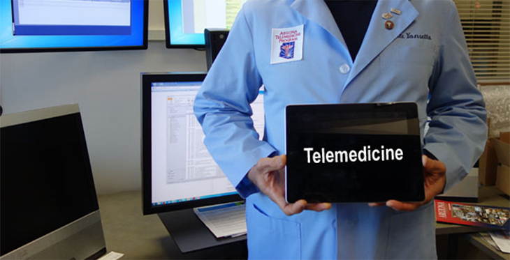 Generic image of someong holding a tablet that says 'Telemedicin'