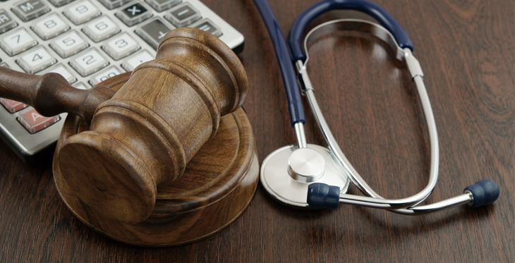 Image of Stethoscope, gavel and keyboard