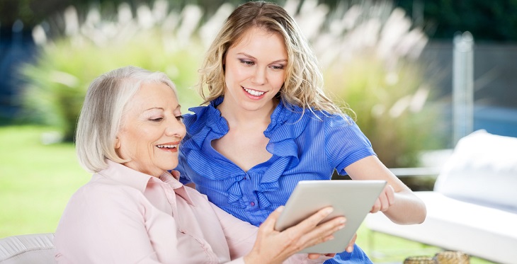 Image of person assisting an elder person